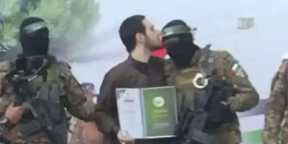Omar Shem Tov kisses the terrorist who held him captive at the moment of his release. Photo: Arab Networks Terrorist who held Omer Shem Tov captive in Gaza eliminated