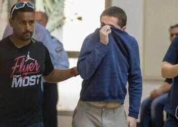Michael Kadar extradited to US. Photo AFP 'Ashkelon hacker' extradited to US, could face 35 years in prison
