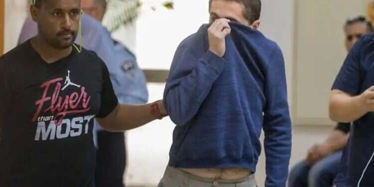 Michael Kadar extradited to US. Photo AFP 'Ashkelon hacker' extradited to US, could face 35 years in prison