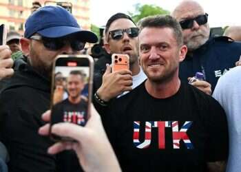 Tommy Robinson at a protest in Britain. Photo Reuters Tommy Robinson at a protest in Britain