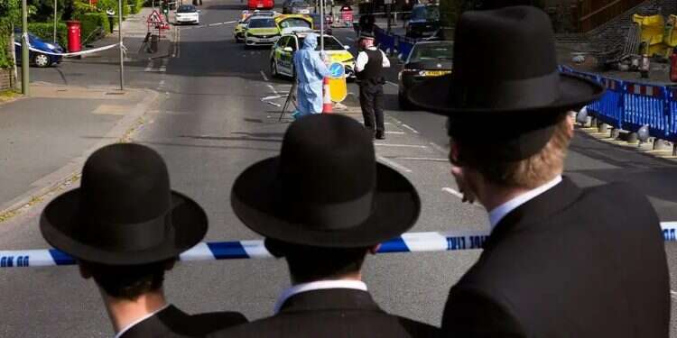 Ultra-Orthodox Jewish youths near the scene of a terrorist attack targeting Jews in Golders Green, London. Photo: AP UK unveils £250 million emergency plan to protect Jewish communities