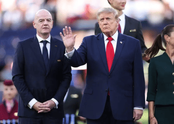 FIFA President Gianni Infantino (L) and US President Donald Trump (C) during the medal presentation ceremony following the 2026 World Cup final Argentine soccer player snubs Trump during World Cup medals ceremony