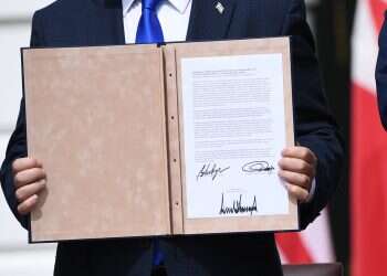 Netanyahu holds a copy of the agreement with Bahrain. Photo: AFP Arab state urged another to make peace with Israel as cover for war