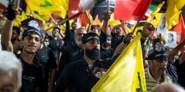 Hezbollah supporters wave the terrorist group’s flag and the Iranian flag in Beirut. Photo: Getty Images Hezbollah moves to undermine Lebanon-Israel framework agreement