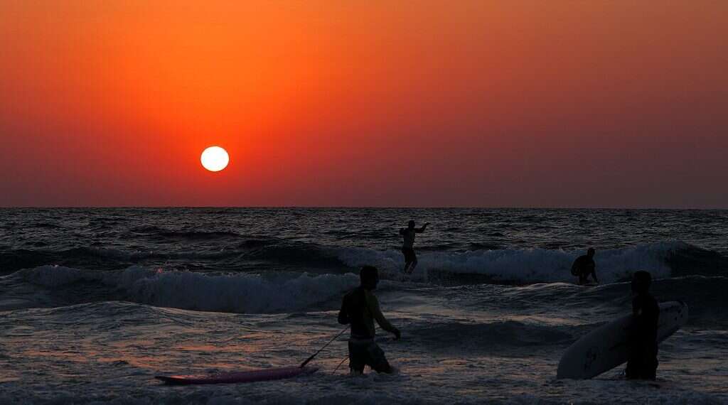 People enjoy leisure time by the Mediterranean beach in Tel Aviv, Israel. Photo: Gil Cohen Magen/Xinhua via Getty Images The light across the sea