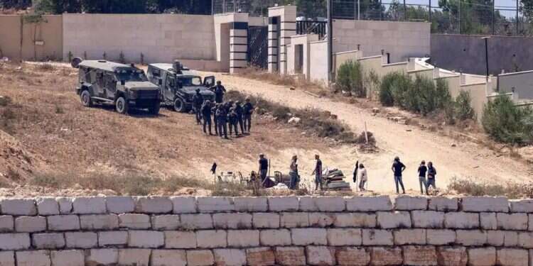 IDF forces in Qusra. Photo: AFP IDF forces in Qusra
