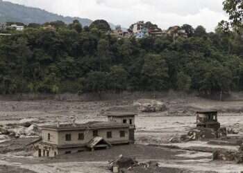 Mud covers a property following a flash flood at Trishuli in Nuwakot district, Nepal, August 26, 2026 9 dead as flash floods devastate Nepal-Tibet region; hundreds of tourists unaccounted for