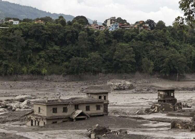 Mud covers a property following a flash flood at Trishuli in Nuwakot district, Nepal, August 26, 2026 9 dead as flash floods devastate Nepal-Tibet region; hundreds of tourists unaccounted for