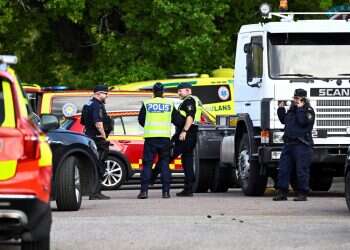 Police and emergency personnel work outside Brinellskolan during a major emergency response, after several people were injured at a Swedish high school by a person armed with a sword at Brinell School, in Fagersta, central Sweden, August 21, 2026 Sword attack at Swedish school leaves teen girl dead, 3 wounded