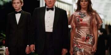 President Donald Trump arrives for a New Year's Eve gala at his Mar-a-Lago resort with first lady Melania Trump and their son Barron, Sunday, Dec. 31, 2017, in Palm Beach, Fla. (AP Photo/Evan Vucci) *** Local Caption *** 02.01.18 Iran video threatens Barron Trump's life