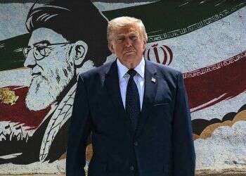 Trump against the backdrop of a poster of Iranian Supreme Leader Ali Khamenei in Tehran. Photo: EPA, AFP Inside Trump's reversal on Iran