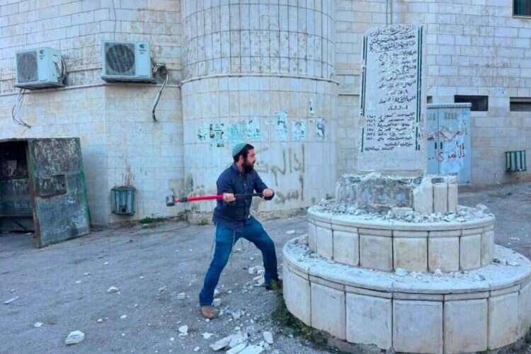 Tzvi Sukkot after taking a sledgehammer to destroy a terrorist shrine