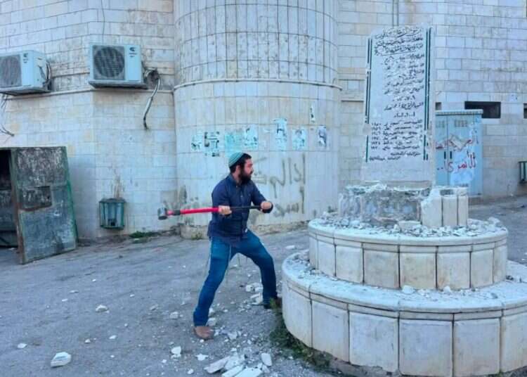 Tzvi Sukkot after taking a sledgehammer to destroy a terrorist shrine MK takes sledgehammer to Palestinian town – smashes terror shrines