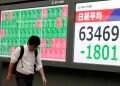 Asian stocks sink on crude oil surge