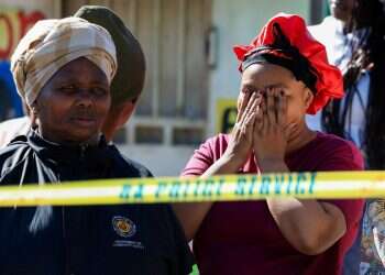Mass shootings near Johannesburg and Cape Town leave 27 dead, South African police report