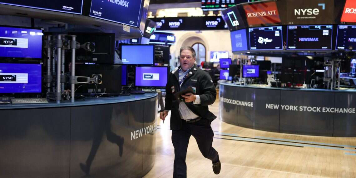 A trader runs on the floor of the New York Stock Exchange (NYSE) at the opening bell in New York City on April 3, 2025 Tech stocks bleed, oil spikes as dual crises hammer investors