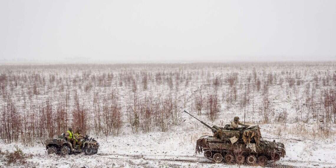 Soldiers take part in the NATO annual military exercise 'Winter Shield' 2021 in Adazi, Latvia, on November 29, 2021. NATO troops in Latvia race to close a drone warfare gap