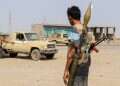 Forces loyal Yemen's Saudi-backed government stand near a pick-up truck in the Hays district, south of Hodeidah on September 5, 2026 Yemen government forces capture Houthi base amid multi-front battles
