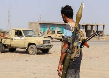 Forces loyal Yemen's Saudi-backed government stand near a pick-up truck in the Hays district, south of Hodeidah on September 5, 2026 Yemen government forces capture Houthi base amid multi-front battles