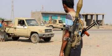 Forces loyal Yemen's Saudi-backed government stand near a pick-up truck in the Hays district, south of Hodeidah on September 5, 2026 Yemen government forces capture Houthi base amid multi-front battles