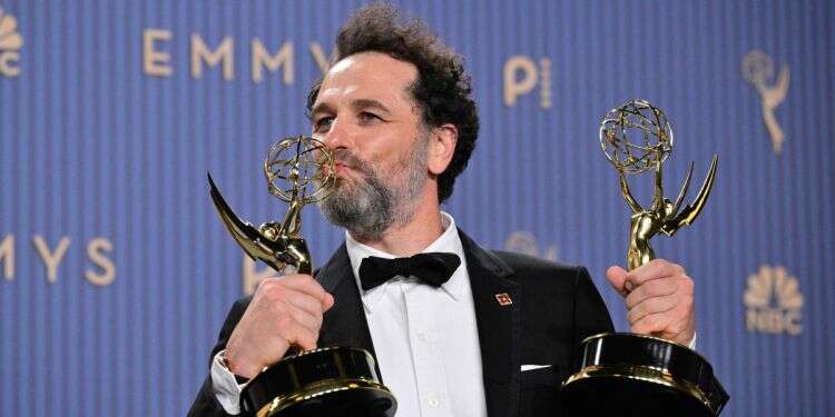 Welsh actor Matthew Rhys winner of the awards for Outstanding Lead Actor in a Comedy Series for 'Widow's Bay' and Outstanding Lead Actor in a Limited or Anthology Series or Movie for 'The Beast in Me' poses in the press room during the 78th Primetime Emmy Awards at the Peacock Theatre at LA Live in Los Angeles on September 14, 2026. Matthew Rhys makes Emmys history as Widow's Bay sweeps the ceremony