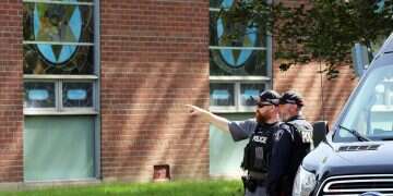 Police stand in front of the Son of Jacob Synagogue in Belleville, Ontario Ontario on Monday Sept. 21, 2026 after the Yom Kippur attack earlier that day 'Cop saved everyone's life': Outpouring of support for Belleville hero
