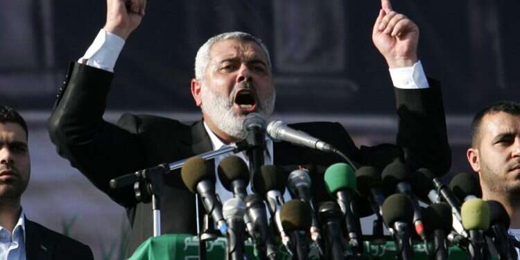 Then Palestinian Prime Minister and Hamas leader, Ismail Haniyeh, speaks to his supporters during a rally December 14, 2008 in Gaza city, Gaza Strip. Hundreds of thousands attended the Hamas rally to mark of its 21th anniversary UK gave Hamas leader's bodyguard citizenship; now he is part of foiled terror plot
