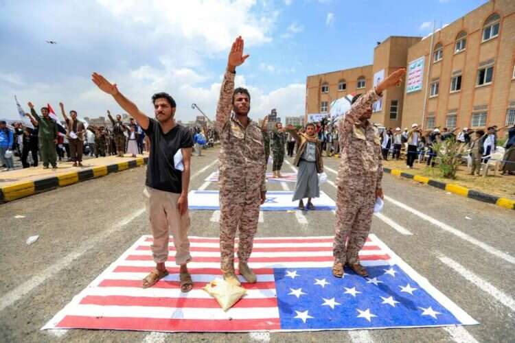 Houthi rebels march in Sana'a, the occupied capital of Yemen