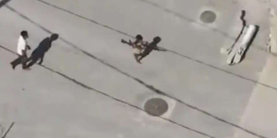 Terrorist caught on camera using child as human shield to smuggle weapons in Gaza