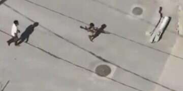 Terrorist caught on camera using child as human shield to smuggle weapons in Gaza