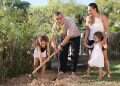 Omri Miran and Lishay Miran-Lavi plant a pomegranate tree with their daughters in the yard of their home in Carmit | Photo: Yehonatan Shaul 'Now I'm living': Omri Miran rebuilds life after Hamas captivity