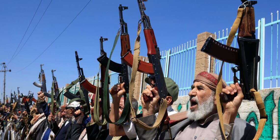 Houthi operatives shout slogans while holding up weapons in Sana'a, Yemen, October 7, 2026 Houthis call Egypt's troop deployment to Saudi Arabia 'declaration of war'