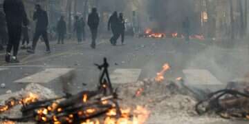 Flames and smoke rise during demonstrations in Paris, France, October 17, 2026 Synagogue vandalized in Paris amid nationwide chaos