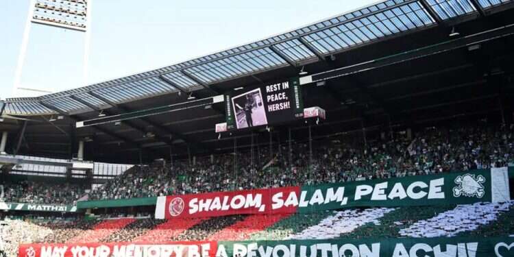Soccer fans in Germany pay tribute to the late Hersh Goldberg-Polin, Photo: Getty Images Showing antisemitism the red card
