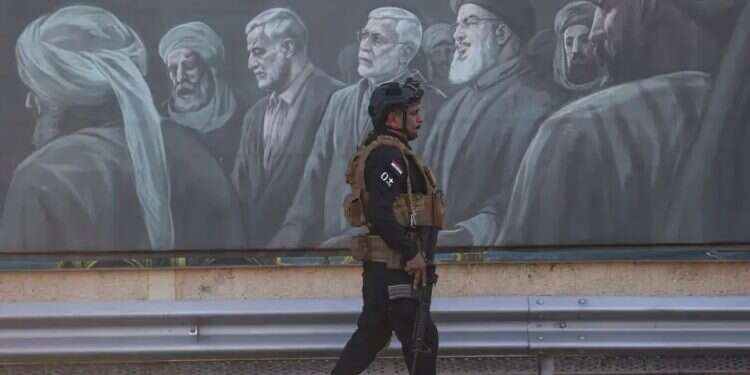 An Iraqi special forces soldier walks past a mural depicting Hezbollah leader Hassan Nasrallah and senior Iranian officials who were killed | Photo: AFP US withdraws from Iraq, leaving it at Iran's mercy