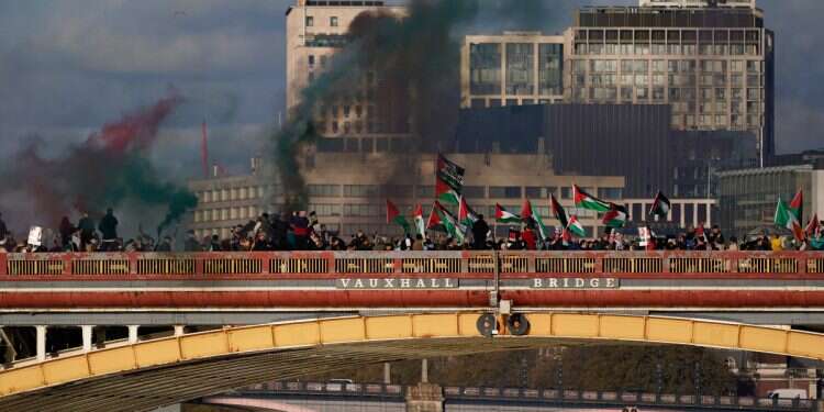 Protesters wave flags and hold flares during a pro-Palestinian protest in London, on Nov. 11, 2023. Antisemitism is spiking across Europe after Hamas' Oct. 7 massacre and Israel's bombardment of Gaza, worrying Jews from London to Geneva and Berlin Europe's blind spot: How punishing Israel emboldens its own enemies