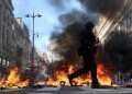 French PM declares partial curfew as riots sweep the country